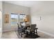 Dining room with wood floors, view of the lake and waterway, and decor on the walls at 13182 Twin Bridges Dr, Riverview, FL 33579