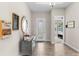 Bright foyer with a decorative mirror and a view of the bedroom and hallway at 13182 Twin Bridges Dr, Riverview, FL 33579