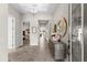 Bright foyer with decorative mirror and a view into the home's open floor plan at 13182 Twin Bridges Dr, Riverview, FL 33579