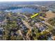 Aerial view showing home's location in a desirable neighborhood near a lake at 13904 Shadow Tree Ln, Tampa, FL 33618