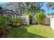 Landscaped backyard with a view of the pool at 13904 Shadow Tree Ln, Tampa, FL 33618