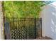 Black metal gate with bamboo accents providing privacy at 13904 Shadow Tree Ln, Tampa, FL 33618