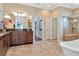 Spa-like bathroom featuring a soaking tub and walk-in shower at 13904 Shadow Tree Ln, Tampa, FL 33618