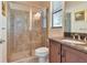 Bathroom with a walk-in shower and a single vanity at 13904 Shadow Tree Ln, Tampa, FL 33618