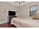 Bedroom with a queen-size bed and hardwood floors at 13904 Shadow Tree Ln, Tampa, FL 33618