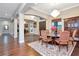 Spacious dining area with hardwood floors and formal dining set at 13904 Shadow Tree Ln, Tampa, FL 33618