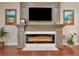 Modern electric fireplace with built-in cabinetry at 13904 Shadow Tree Ln, Tampa, FL 33618