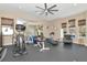 Spacious home gym with various equipment and a mirrored wall at 13904 Shadow Tree Ln, Tampa, FL 33618