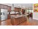 Gourmet kitchen with granite island and stainless steel appliances at 13904 Shadow Tree Ln, Tampa, FL 33618