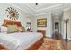 Luxurious main bedroom with hardwood floors, large windows and ensuite bathroom at 13904 Shadow Tree Ln, Tampa, FL 33618