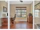 Bright home office with hardwood floors and large window at 13904 Shadow Tree Ln, Tampa, FL 33618