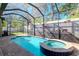 Relaxing pool and spa with screened enclosure at 13904 Shadow Tree Ln, Tampa, FL 33618