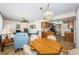 Open dining area with wood table and chairs, offering a view of the kitchen and living room at 14993 Imperial Point N Dr, Largo, FL 33774