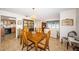 Dining room with wood table and chairs, open to living and kitchen areas at 14993 Imperial Point N Dr, Largo, FL 33774