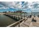 Community dock with benches and water access at 14993 Imperial Point N Dr, Largo, FL 33774