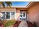 Double white doors with sidelights and landscaping at 14993 Imperial Point N Dr, Largo, FL 33774