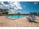 Inviting community pool with ample deck space and lounge chairs at 14993 Imperial Point N Dr, Largo, FL 33774