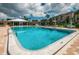 Large, refreshing community pool with plenty of lounge chairs at 14993 Imperial Point N Dr, Largo, FL 33774