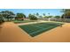 Two well-maintained tennis courts at 14993 Imperial Point N Dr, Largo, FL 33774