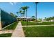 Landscaped walkway leading to community amenities at 14993 Imperial Point N Dr, Largo, FL 33774