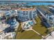 Aerial view of condo building, pool, and surrounding area at 17980 Gulf Blvd # 403, Redington Shores, FL 33708