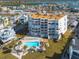 Building with a pool and landscaping, near the water at 17980 Gulf Blvd # 403, Redington Shores, FL 33708