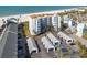 Aerial view of beachfront condo building with parking and ocean views at 17980 Gulf Blvd # 403, Redington Shores, FL 33708