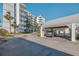 Condo building with covered parking spaces at 17980 Gulf Blvd # 403, Redington Shores, FL 33708