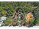 Beautiful aerial view of the home situated among mature trees and next to a new construction site at 18026 Macy Rd, Weeki Wachee, FL 34614