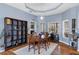 Cozy dining room showcasing a wooden dining set, built-in shelving, neutral paint tones, and natural light at 18026 Macy Rd, Weeki Wachee, FL 34614