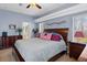 Spacious main bedroom featuring tray ceilings, neutral paint tones, and an ensuite bathroom at 18026 Macy Rd, Weeki Wachee, FL 34614