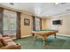 Community game room with a pool table and comfortable seating at 18327 Bridle Club Dr # 18327, Tampa, FL 33647