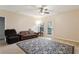 Living room with brown couch, recliner, and patterned rug at 18327 Bridle Club Dr # 18327, Tampa, FL 33647