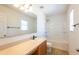 Clean bathroom with tub shower combo, vanity, and tile floor at 18840 Parapet Pl, Land O Lakes, FL 34638