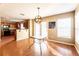 Bright dining room with hardwood floors and glass table at 18840 Parapet Pl, Land O Lakes, FL 34638