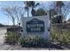 Hillcrest Villas deed restricted community sign with lush landscaping at 24862 Us Highway 19 N # 1602, Clearwater, FL 33763