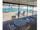 Community pool area with lounge chairs and tables at 24862 Us Highway 19 N # 1602, Clearwater, FL 33763