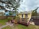 Charming yellow house with a deck and fenced yard at 2526 44Th S St, St Petersburg, FL 33711