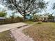 Large backyard with patio and mature tree at 2526 44Th S St, St Petersburg, FL 33711