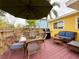 Outdoor deck with seating, table, and grill at 2526 44Th S St, St Petersburg, FL 33711