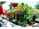 Vibrant yellow restaurant with lush landscaping at 2526 44Th S St, St Petersburg, FL 33711