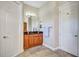 Bathroom with wood cabinets and granite countertop at 2659 Keystone Springs Rd, Tarpon Springs, FL 34688