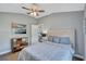 Bright bedroom with a comfortable bed and a charming dresser at 2659 Keystone Springs Rd, Tarpon Springs, FL 34688