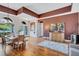 Elegant dining room with hardwood floors and a wine bar at 2659 Keystone Springs Rd, Tarpon Springs, FL 34688