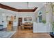 Open concept dining room with hardwood floors and kitchen view at 2659 Keystone Springs Rd, Tarpon Springs, FL 34688