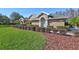 House exterior showcasing walkway and landscaping at 2659 Keystone Springs Rd, Tarpon Springs, FL 34688