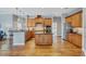 Kitchen with island, granite countertops, stainless steel appliances, and wood cabinets at 2659 Keystone Springs Rd, Tarpon Springs, FL 34688