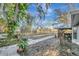 Spacious backyard with a walkway and lush landscaping at 2733 Glenview Dr, Land O Lakes, FL 34639