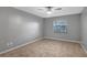 Bedroom with tile floors and ceiling fan at 2733 Glenview Dr, Land O Lakes, FL 34639