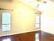 Spacious bedroom with wood floors and large windows at 286 Royal Palm Way, Spring Hill, FL 34608